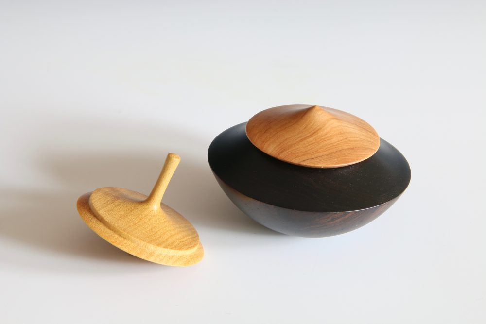 Rocking Box with Spinning Top